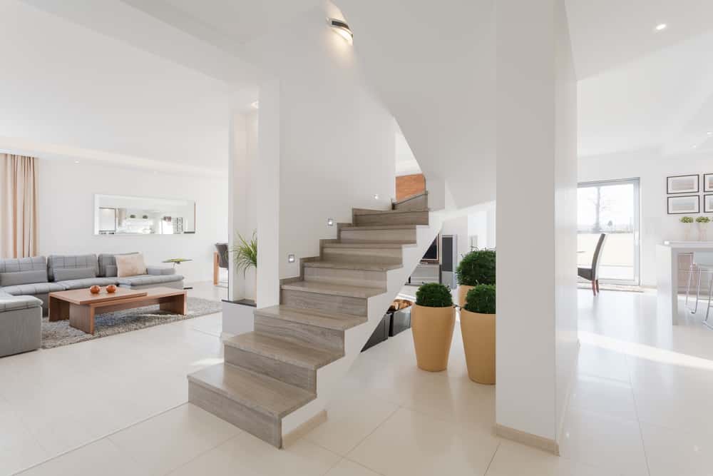 Elegant home staircase tile designs for a bright and open-plan living space