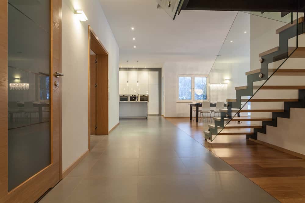 Glass railing designs for stairs with minimalist interior and wood treads