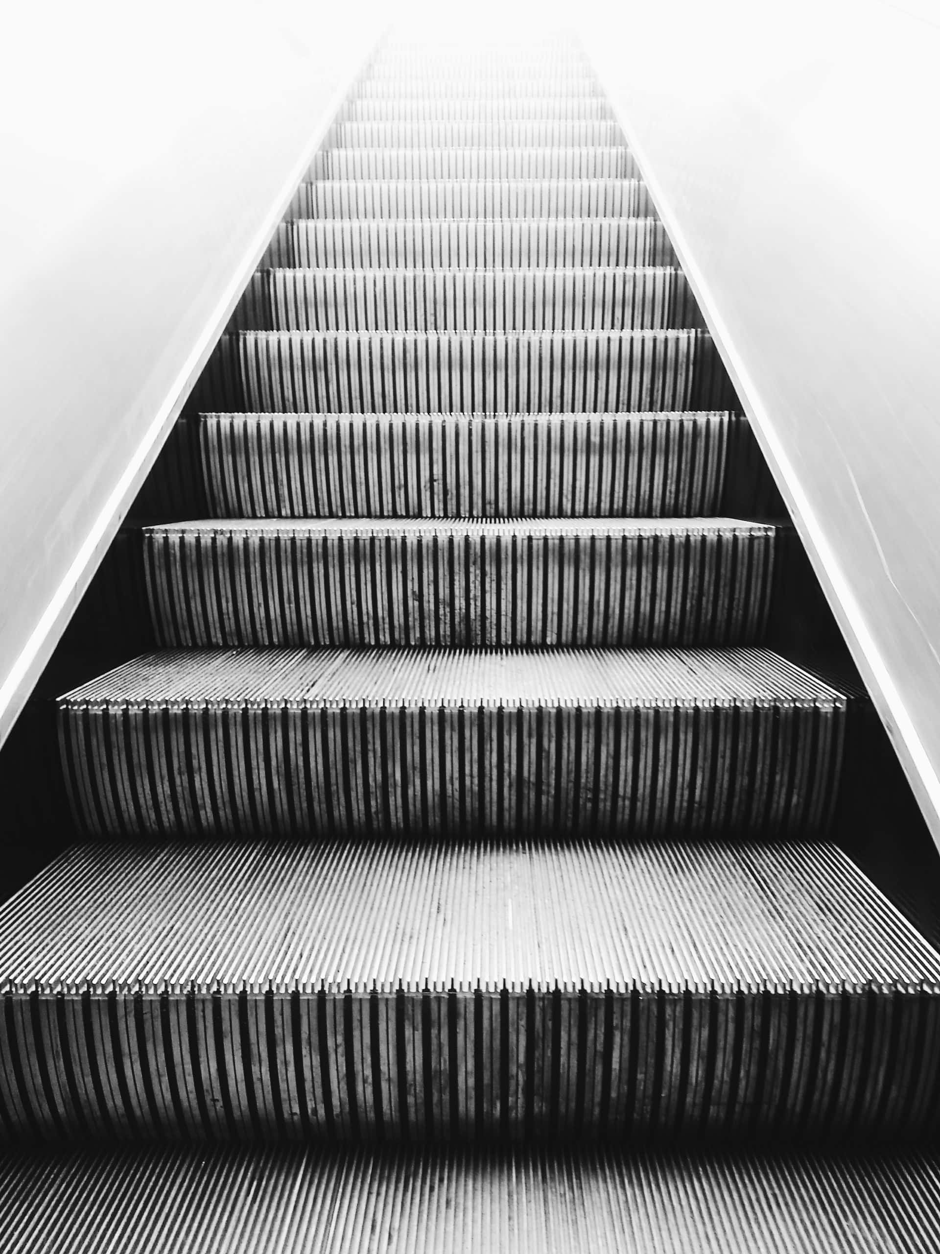 Metallic modern staircase tile designs concept shown through artistic escalator view