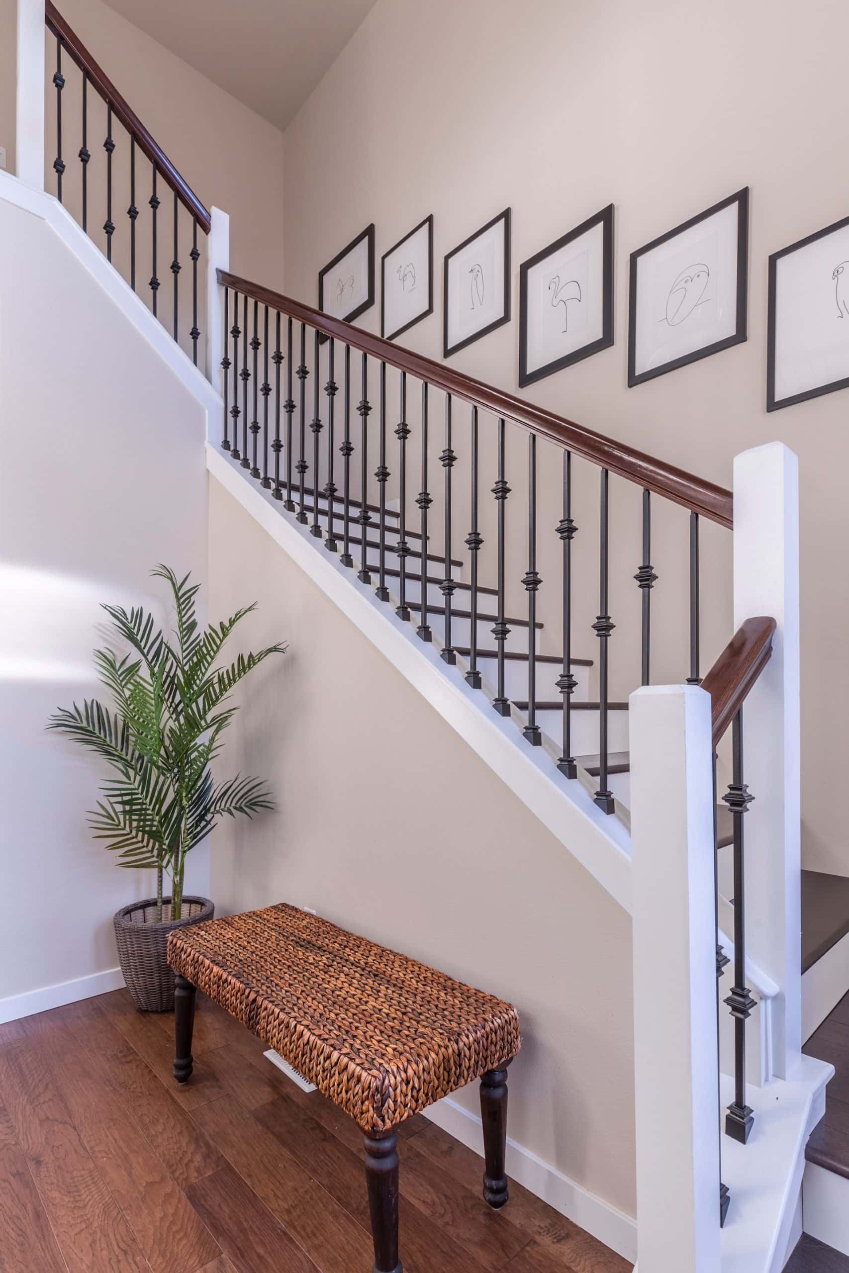 staircase with wall gallery