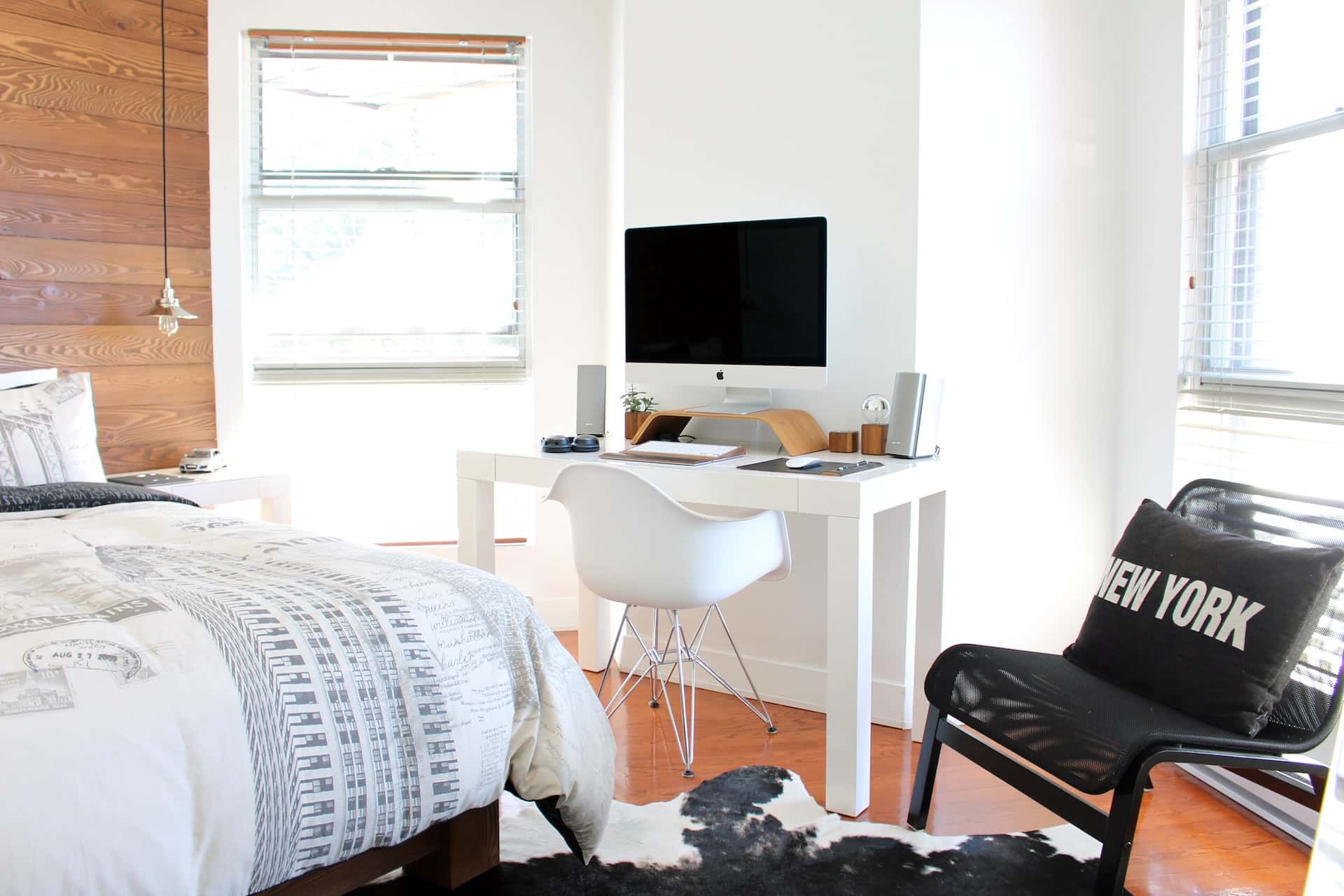 study table in front of the bed