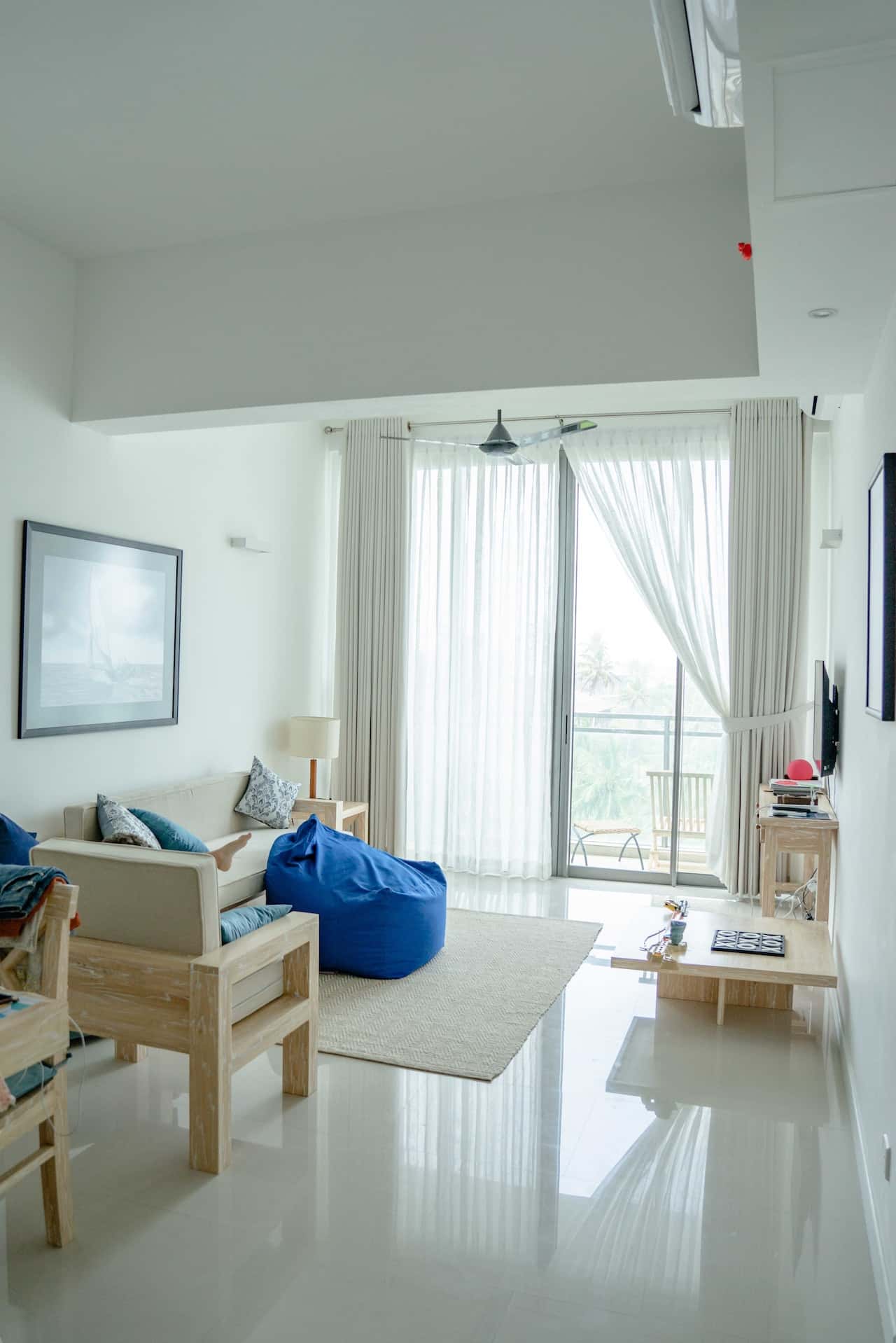 tall wooden folding door with glass