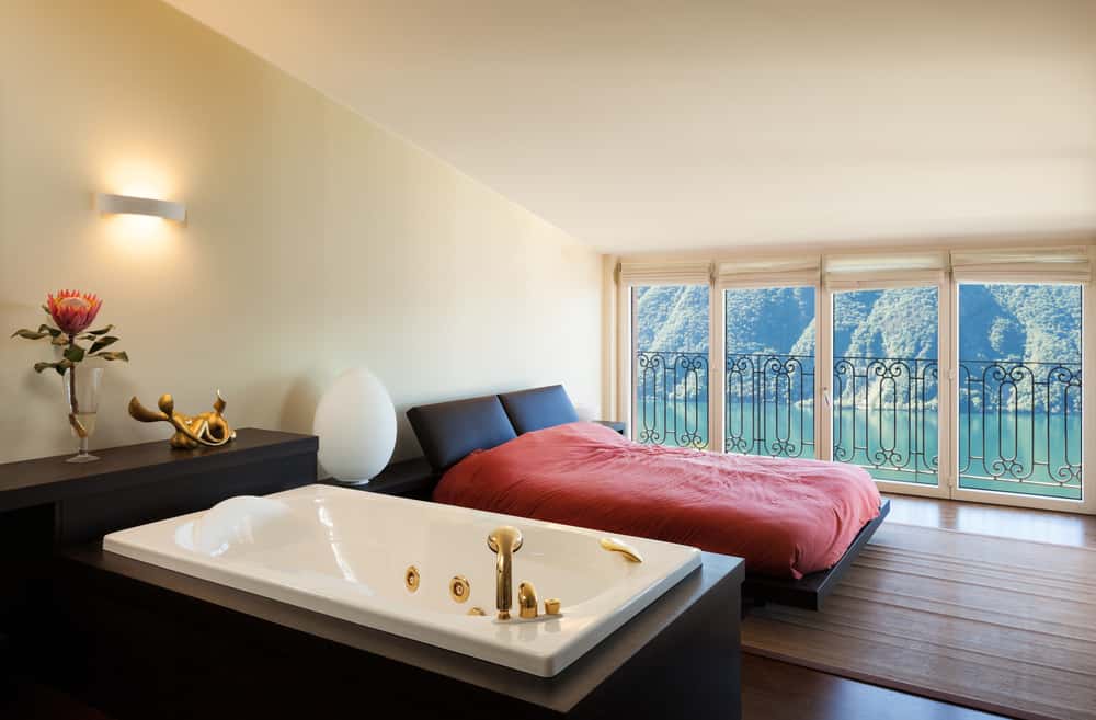 white jacuzzi tub with golden faucet