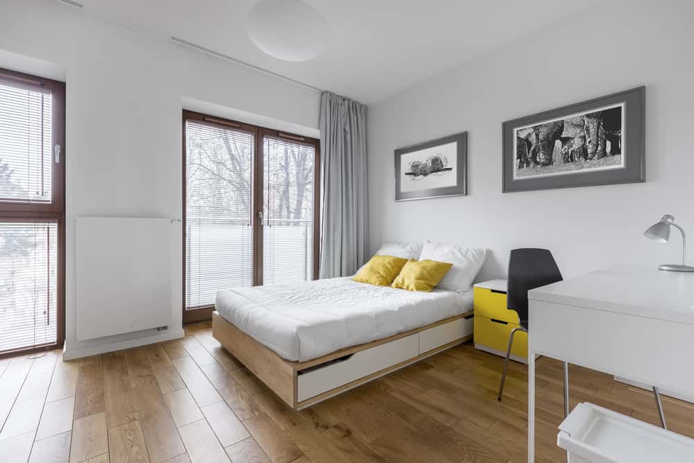 Modern sliding mosquito net door design in bright bedroom