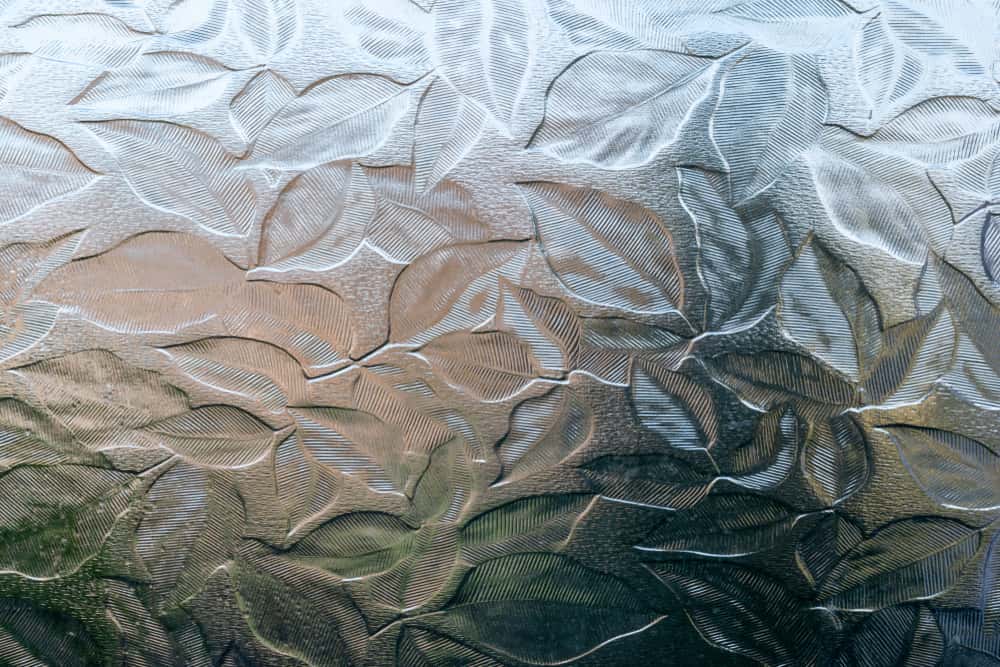 Leaf pattern glass etching designs adding texture and privacy to home windows