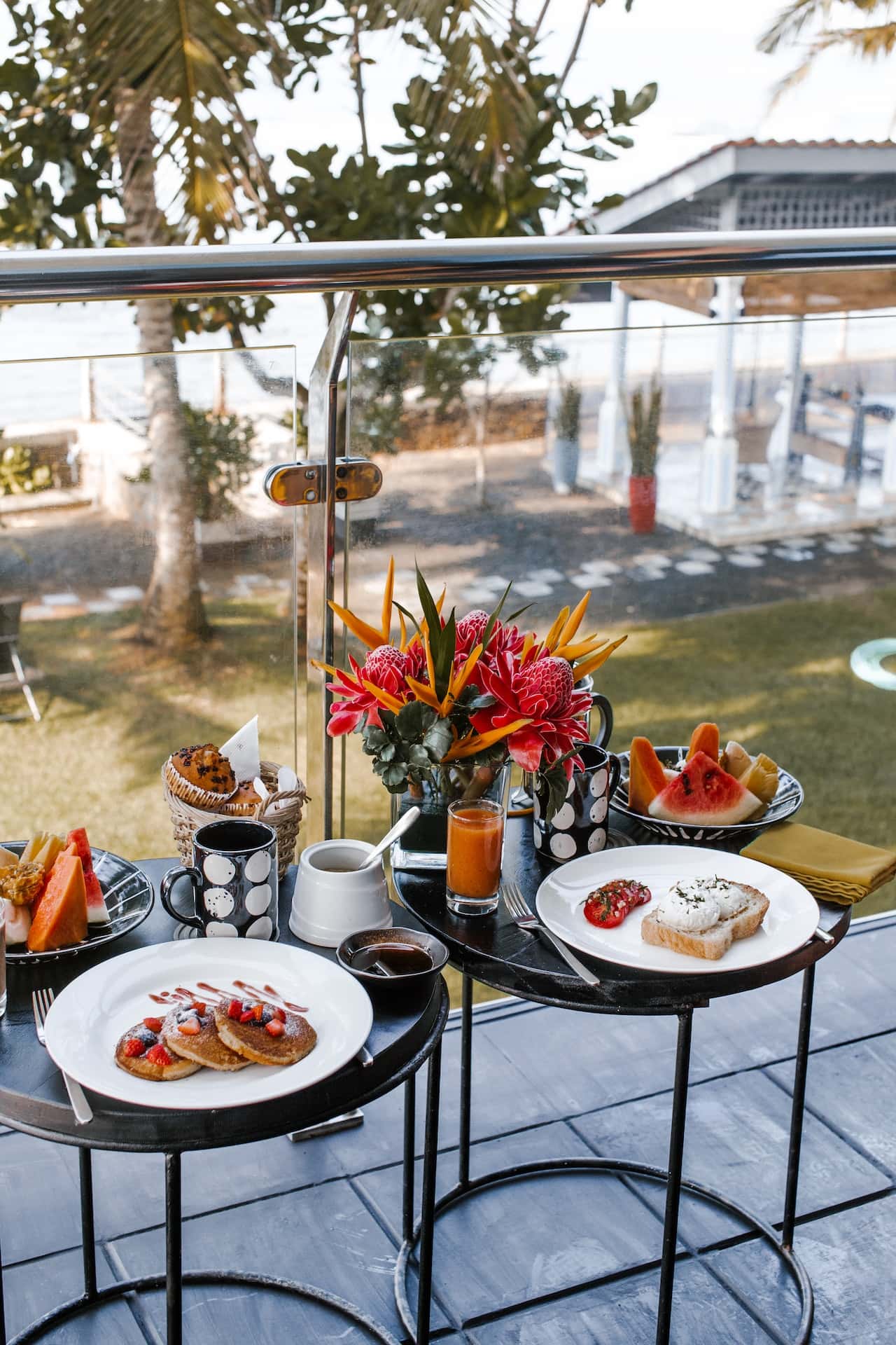 Balcony glass grill designs in cozy outdoor breakfast setup