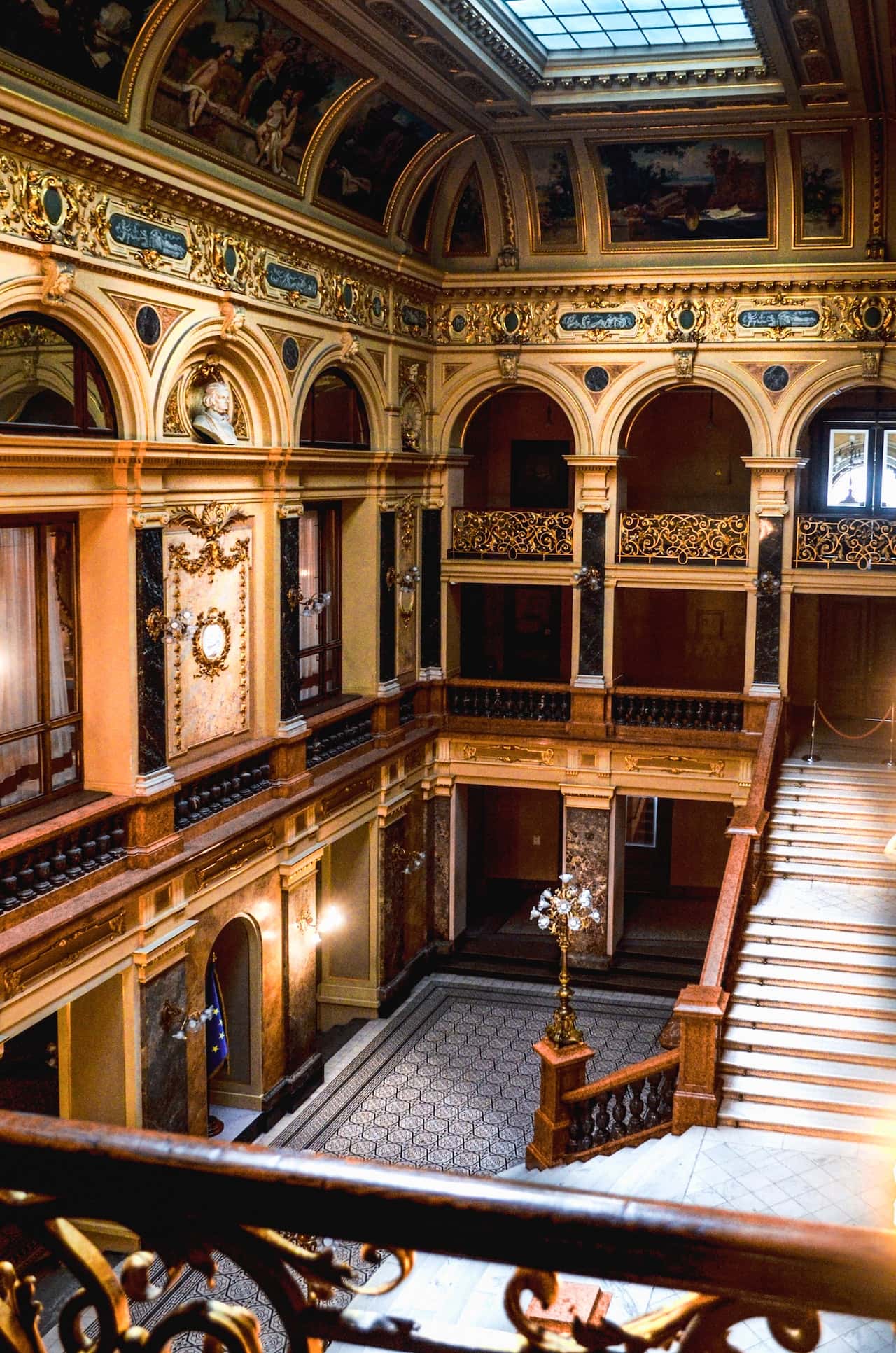Luxurious haveli designs with arches, gold decor, and heritage staircases