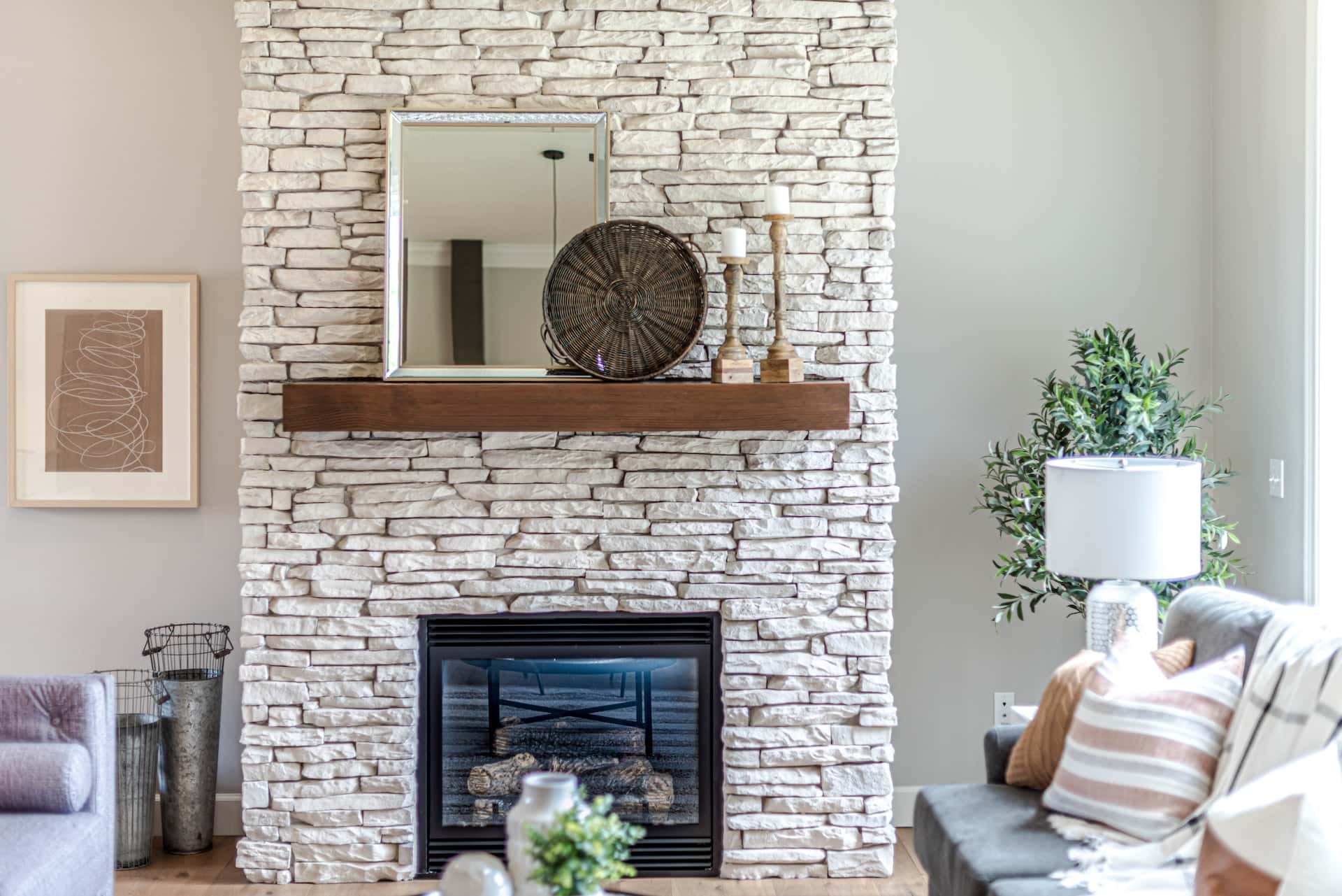 Eco-themed assam type house design with white stone fireplace and warm lighting