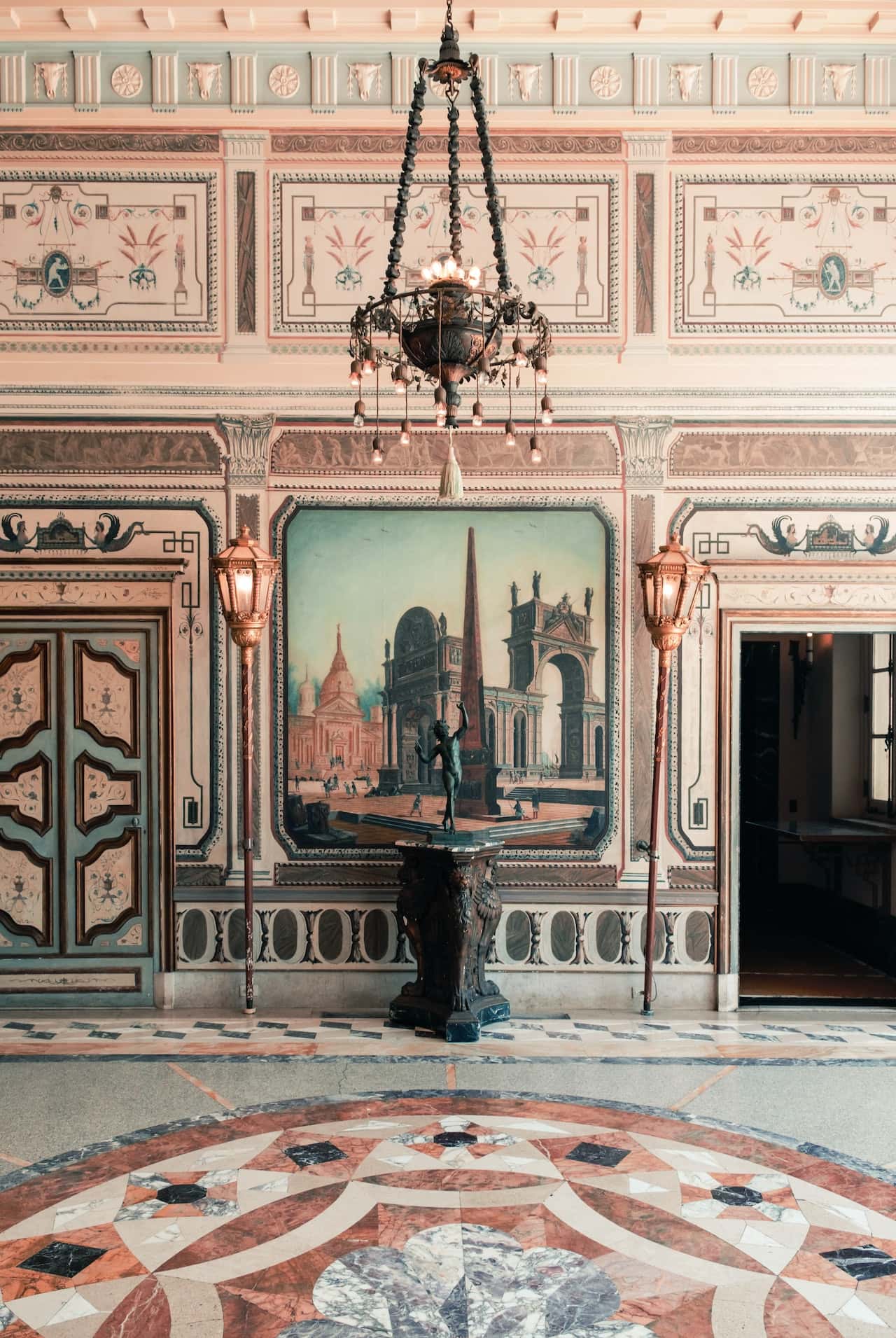 Ornate haveli designs with fresco art, chandeliers, and marble floor motifs