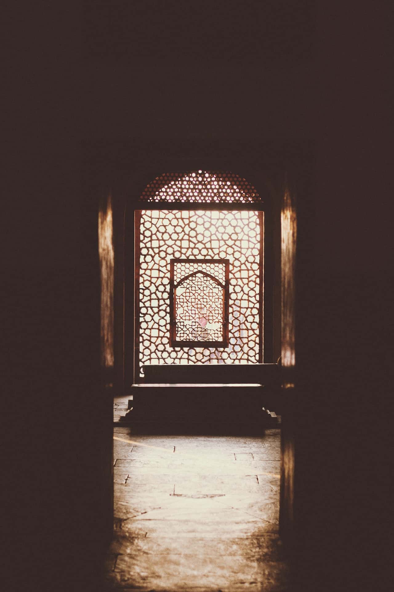 Intricate mandir door designs with traditional carved jali patterns in wood
