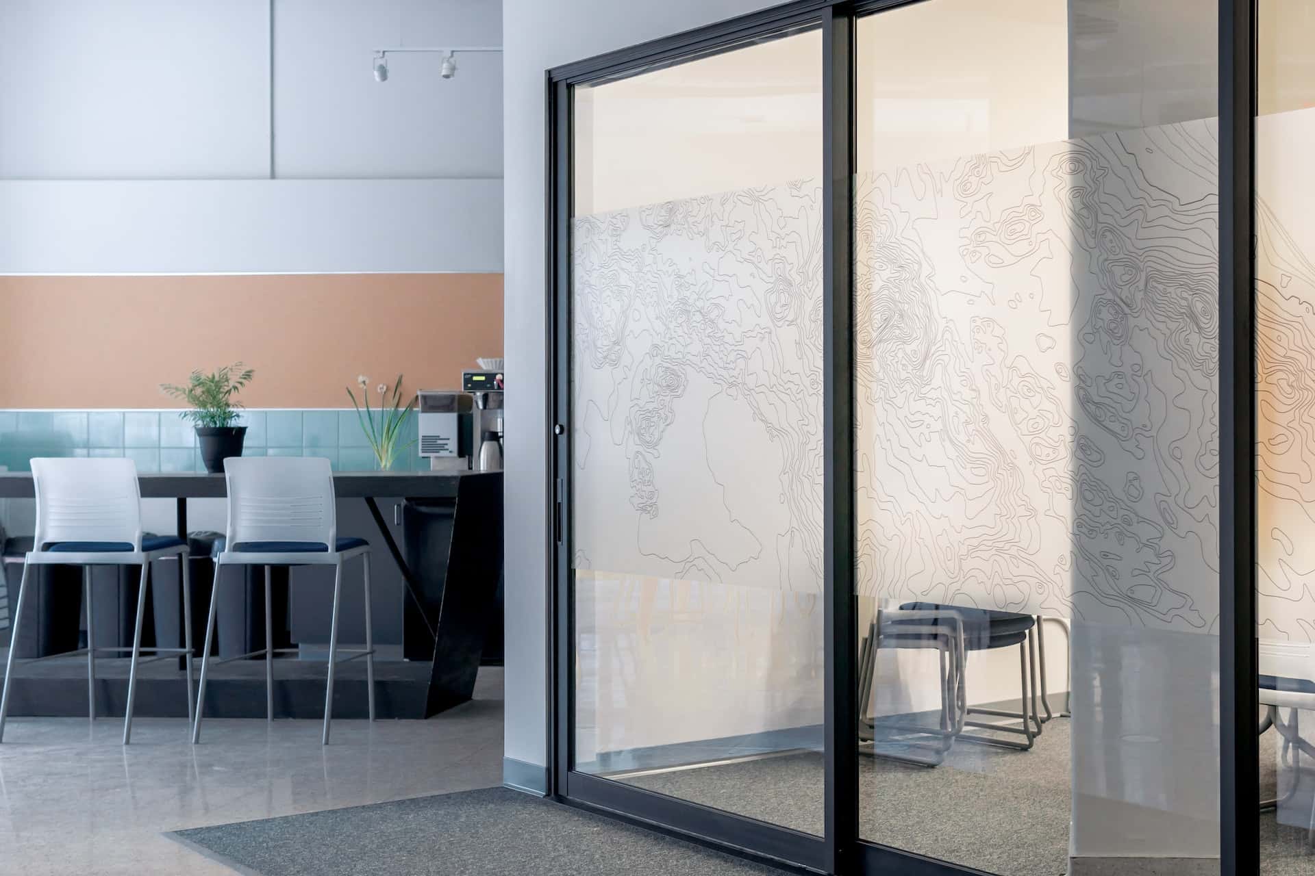 Linear glass etching designs for modern office partitions with privacy and style