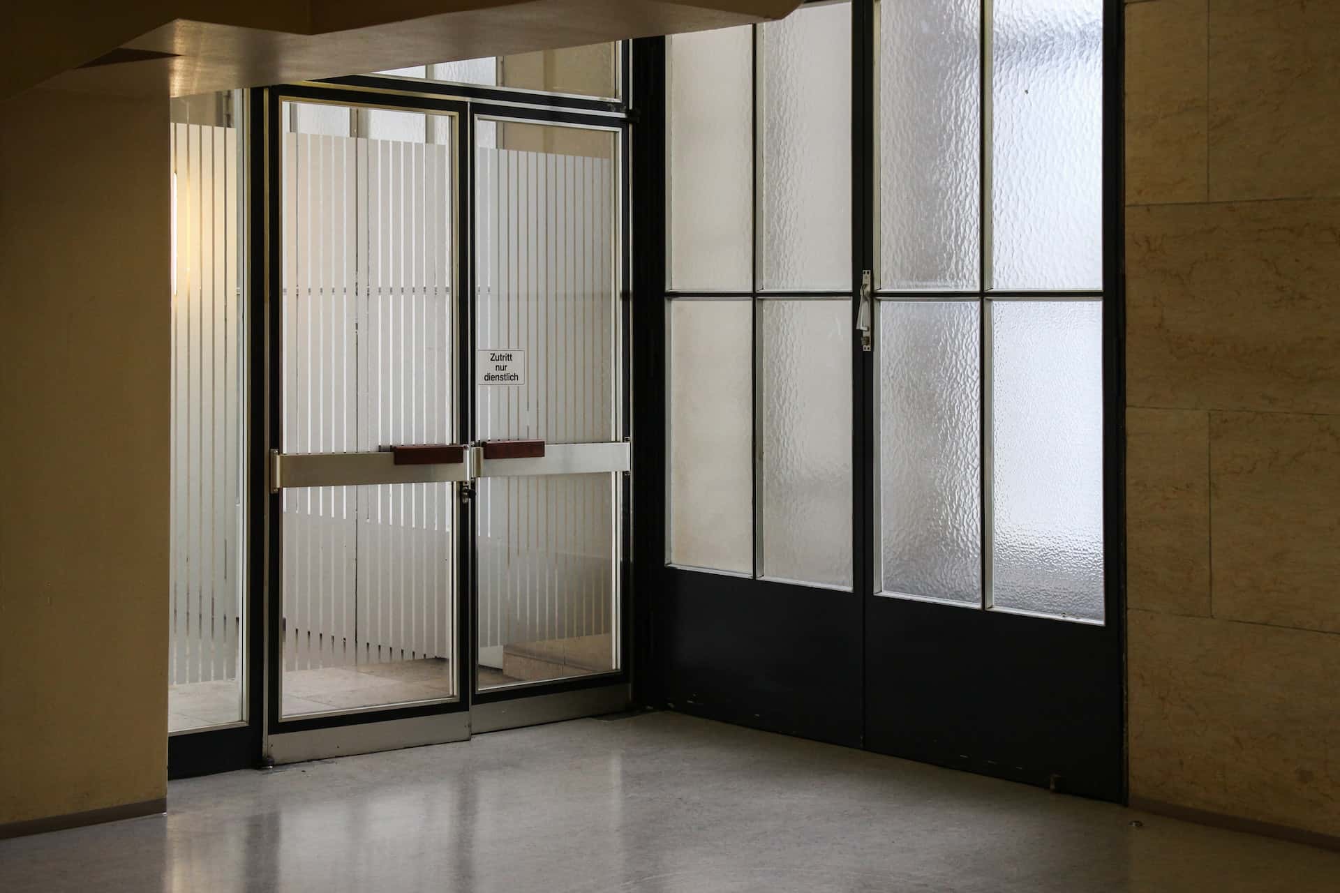 Vertical striped glass etching designs for main doors offering privacy and light