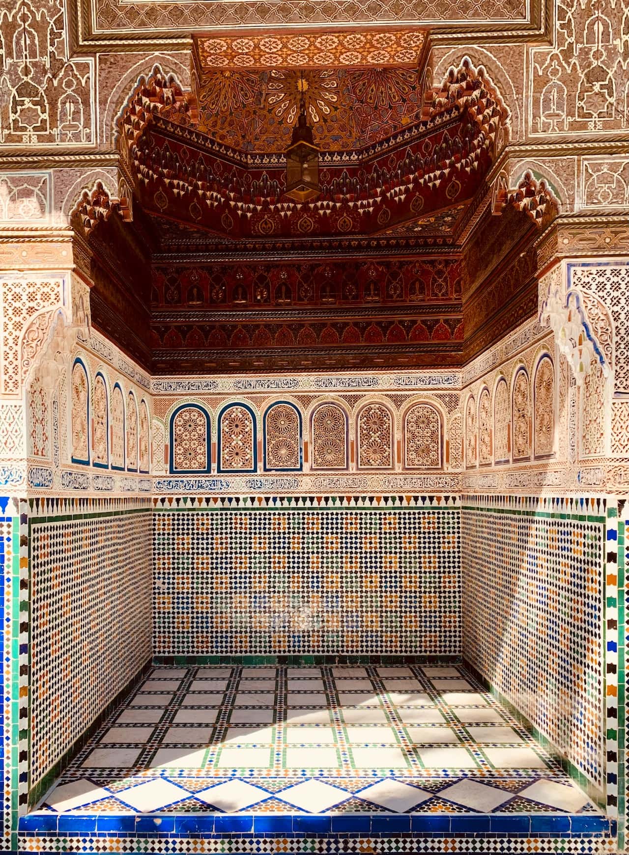 Intricate haveli designs with colorful tiles, carved arches, and ornate ceiling