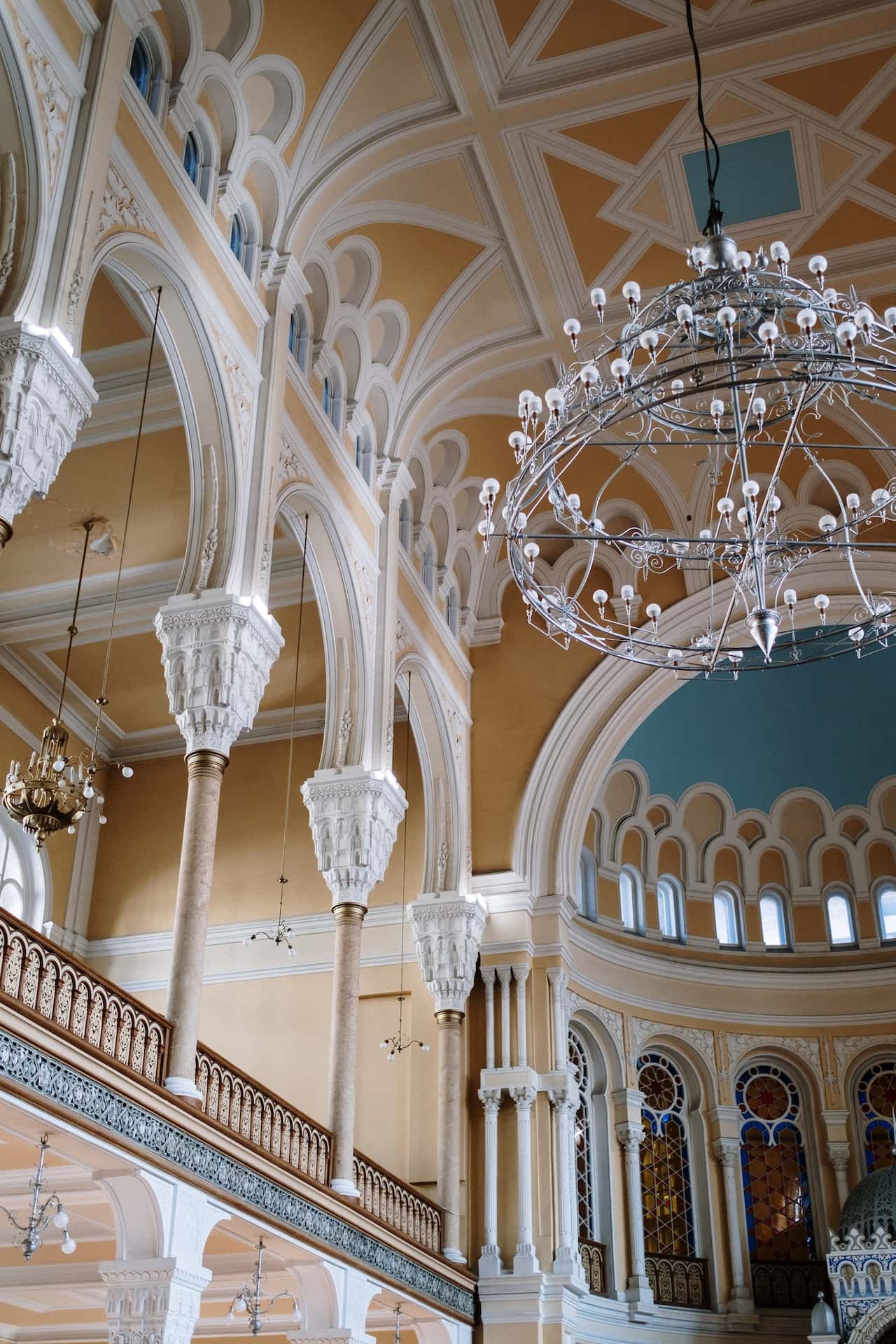 Ornate haveli designs with arches, chandeliers, and intricate royal ceilings