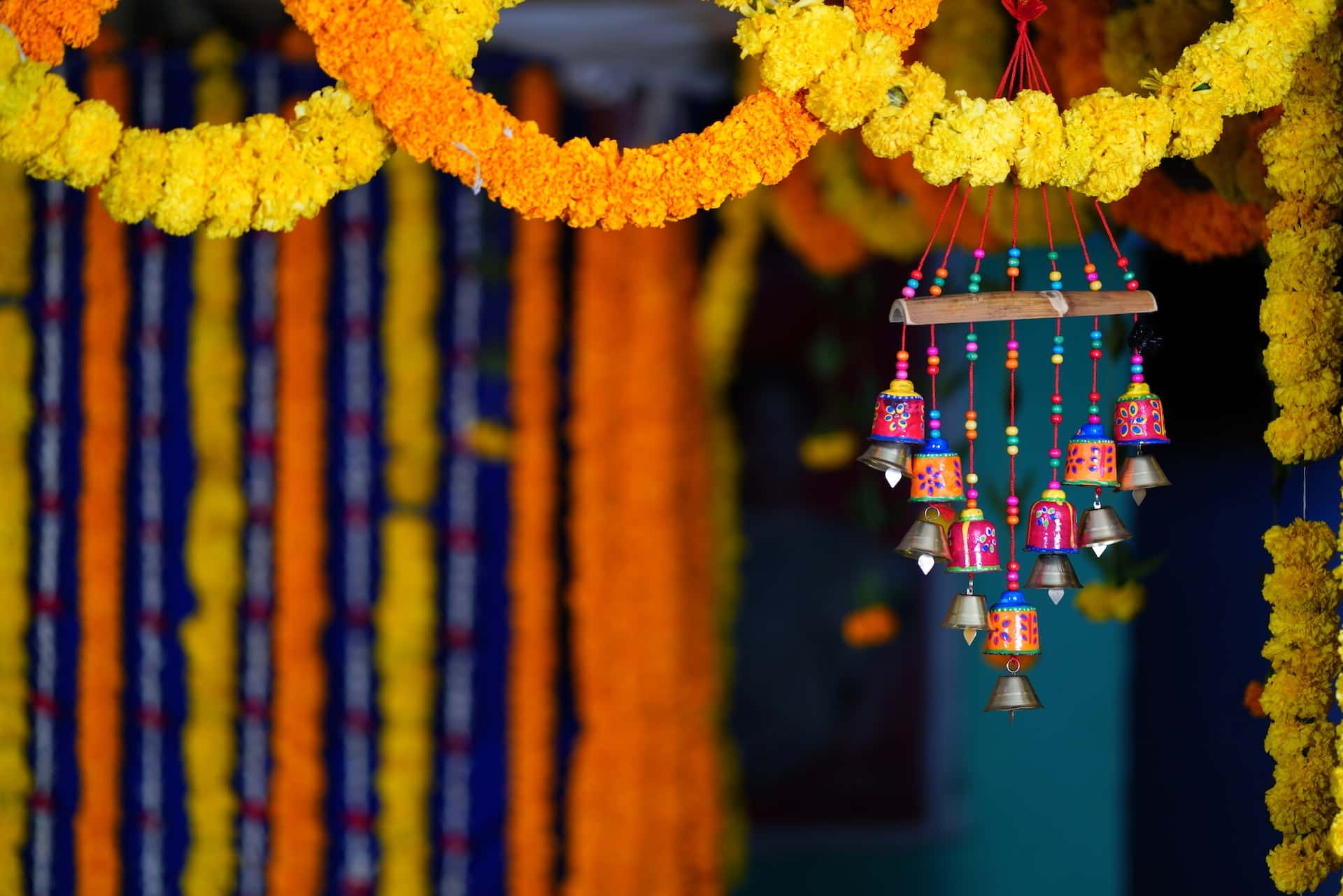Festive haveli designs with marigold garlands and colorful hanging bells