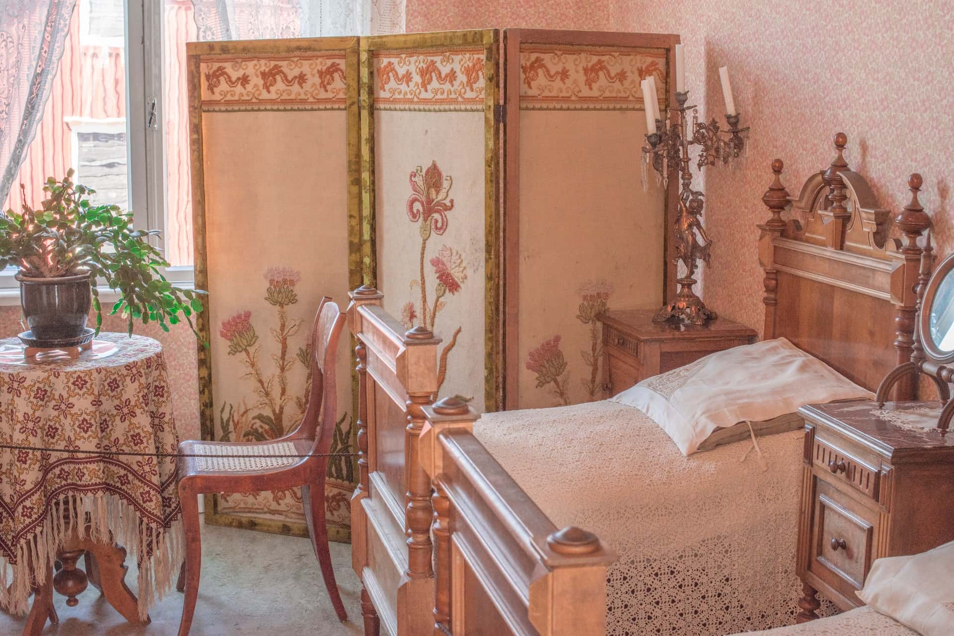 Vintage assam type house room design with wooden beds and floral accents