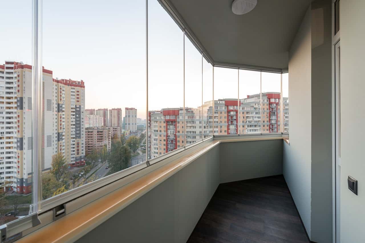 Enclosed glass grill designs for modern high-rise balconies