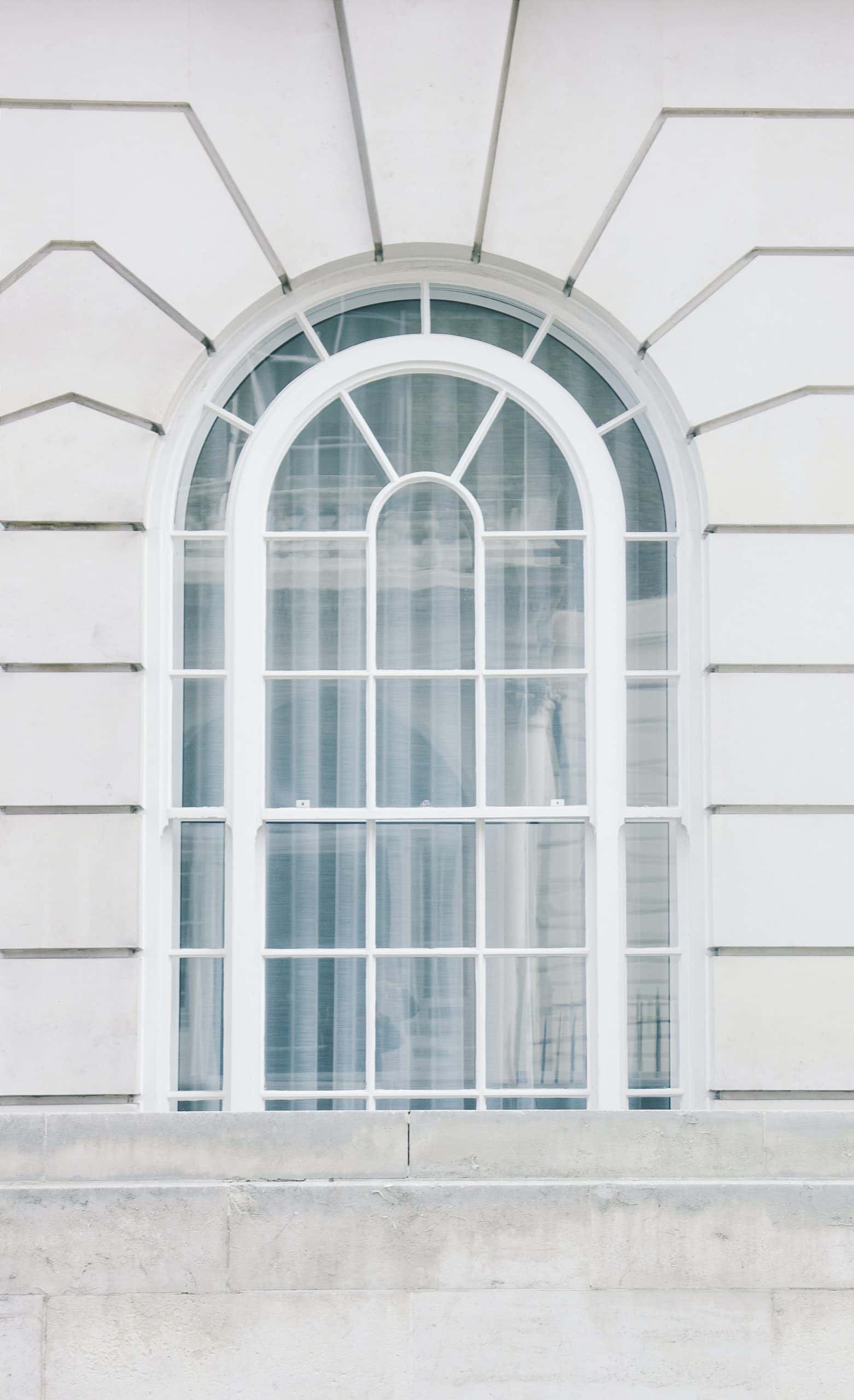 Clean modern sliding window grill design with white metal finish