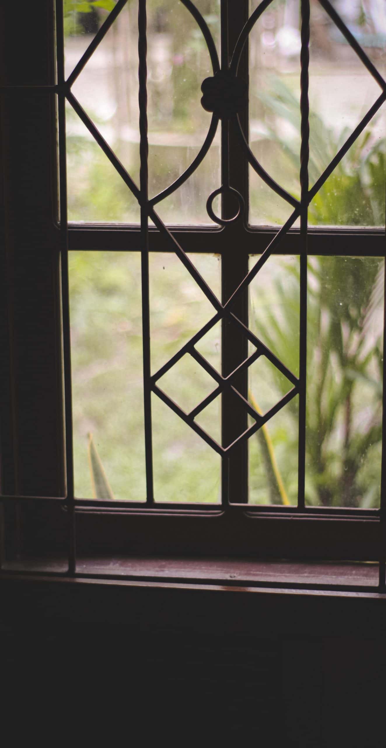 Classic window grill design for home with floral-inspired pattern