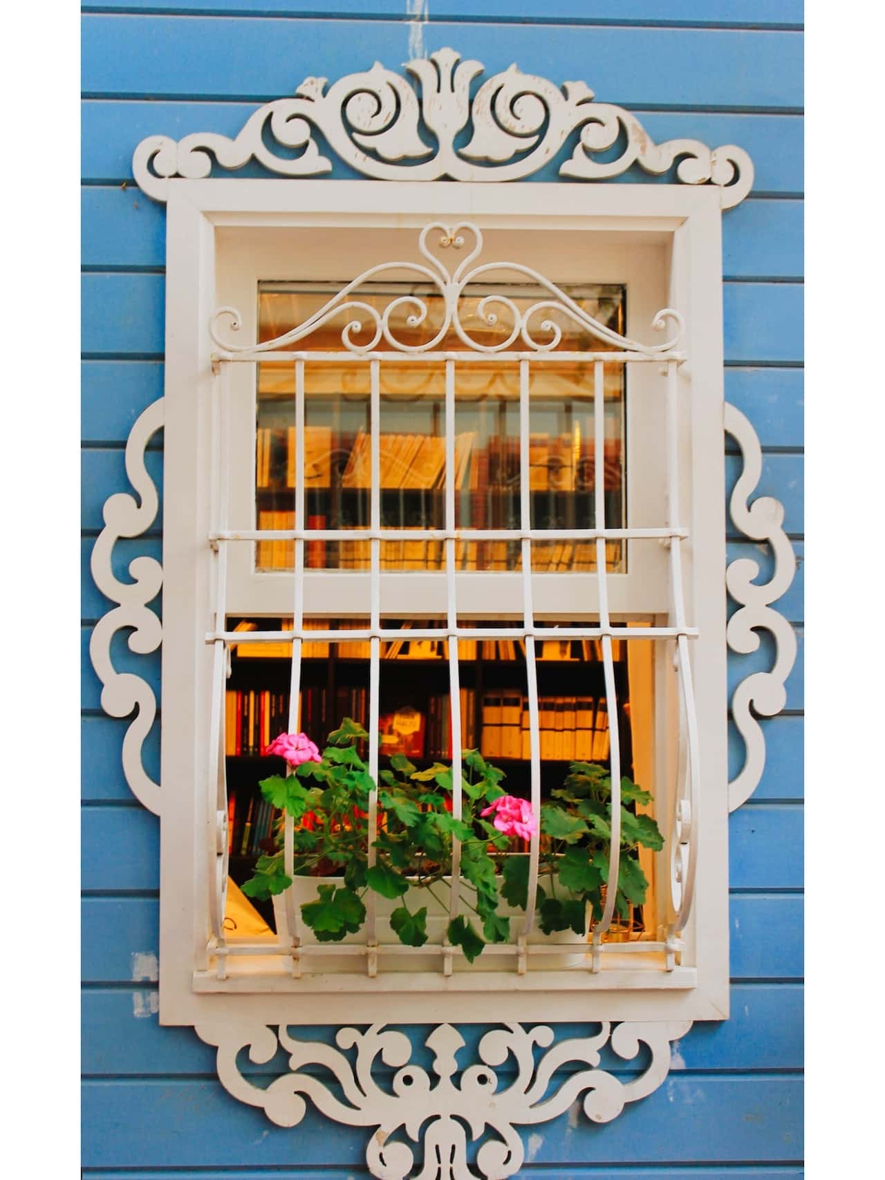 Elegant sliding window grill design with floral accents