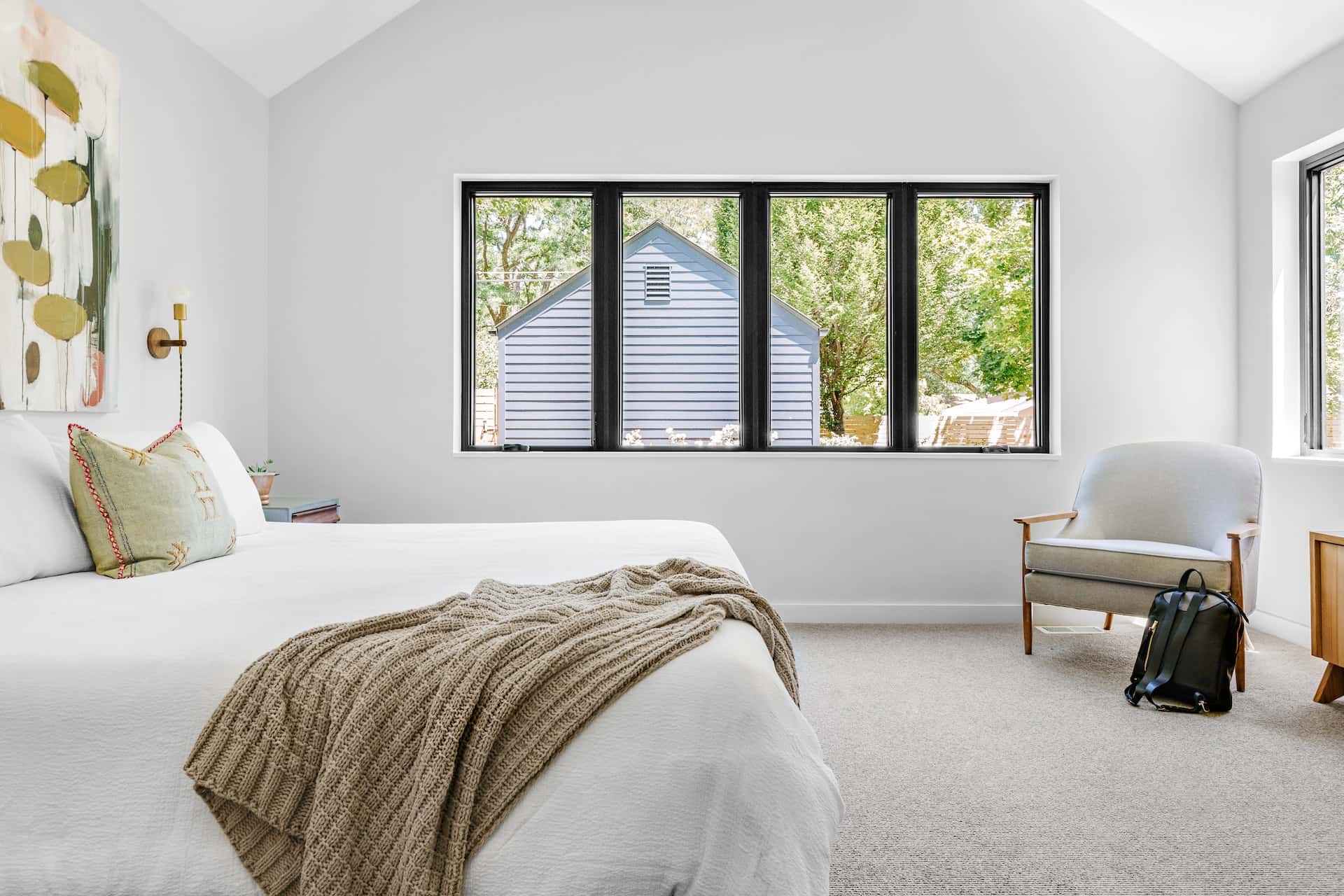 Minimalist sliding window grill design in a cozy bedroom setup