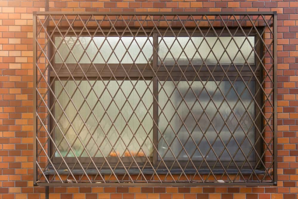 the gridlock wooden window grill design