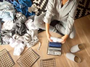 Woman Folds Her Clothes Puts Them