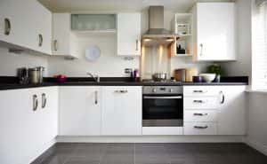 Elegant simple modular kitchen design with white cabinets and modern appliances