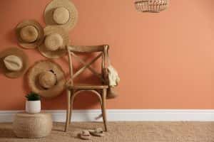 wooden chair bag straw hats on