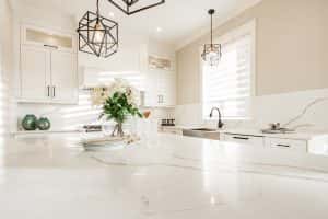 Warm White Kitchen Expansive Countertops Island