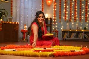 Young Indian Woman Preparing Rangoli