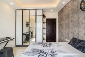 Black and white bedroom theme with cantilevered dressing table by HomeLane