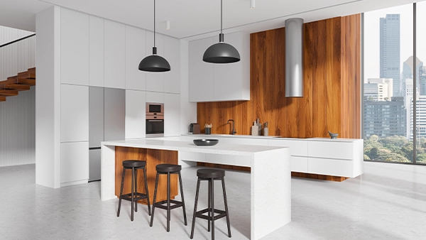Modern kitchen triangle layout with island stools fridge oven and wood panel accents