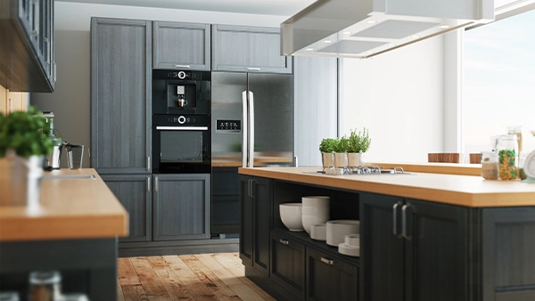Classic modern kitchen cupboards with grey finish and wood countertop in a bright layout
