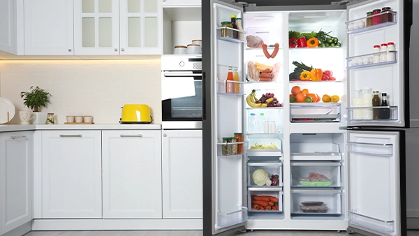Fridge kitchen triangle layout with fresh food organized in a modern white kitchen