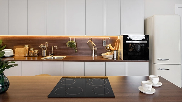 Modern kitchen with a clean kitchen triangle setup featuring stove sink and refrigerator