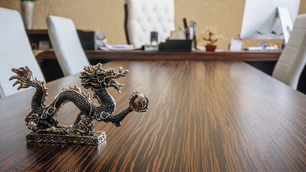 Figurine asian dragon on table business