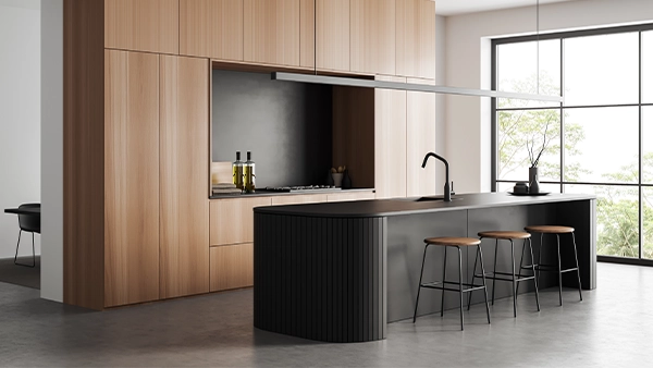 Sleek modern kitchen cupboards with matte black island and wooden panel wall finish