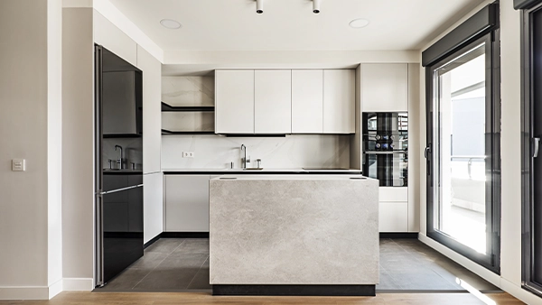 Minimalist kitchen triangle layout with island sink fridge and wall oven in bright space