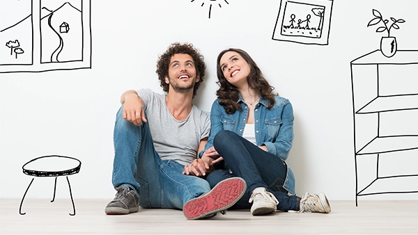Happy young couple sitting in portrait
