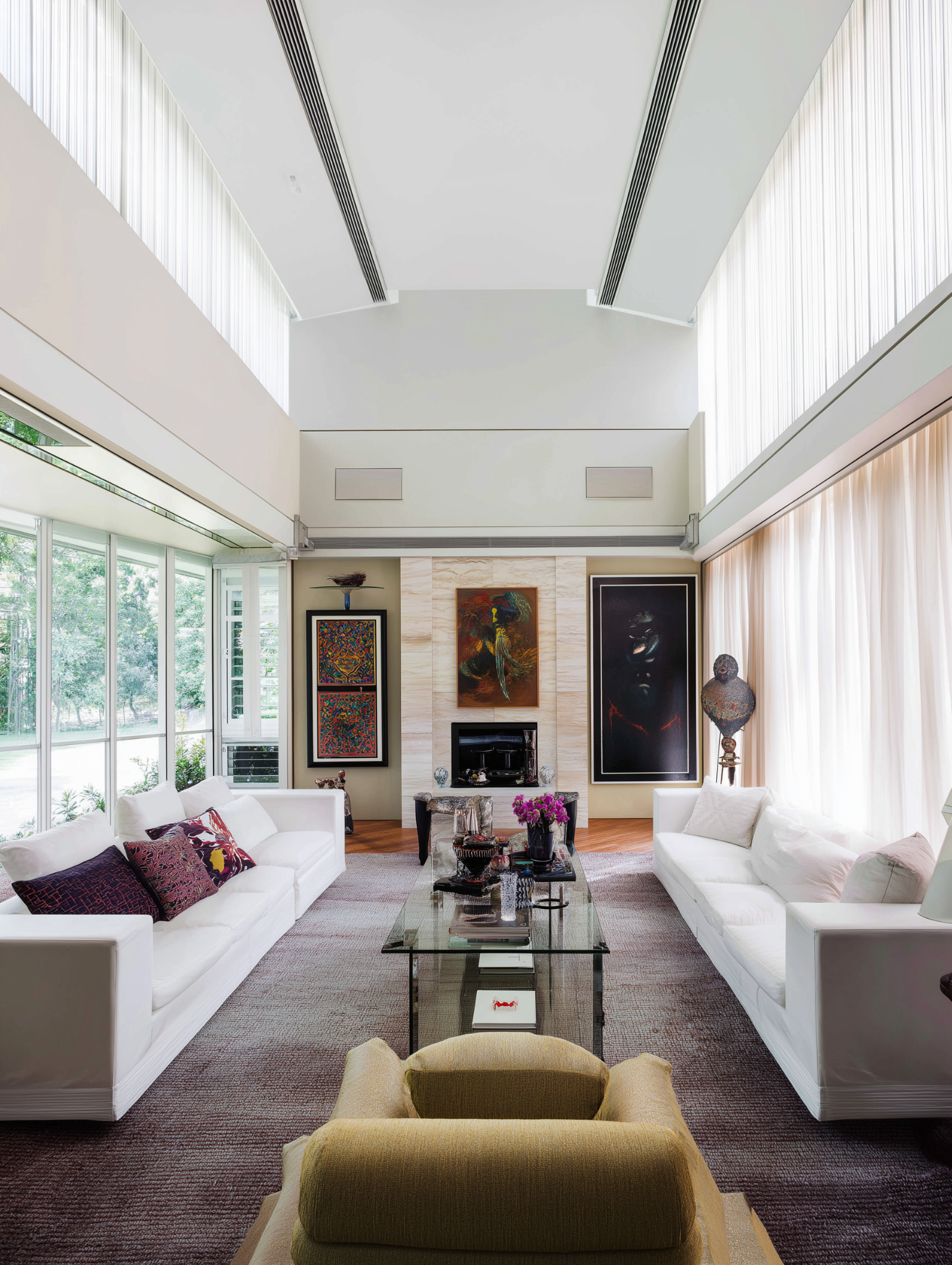 Elegant high ceiling living room with home wellness designs featuring art soft light and balance