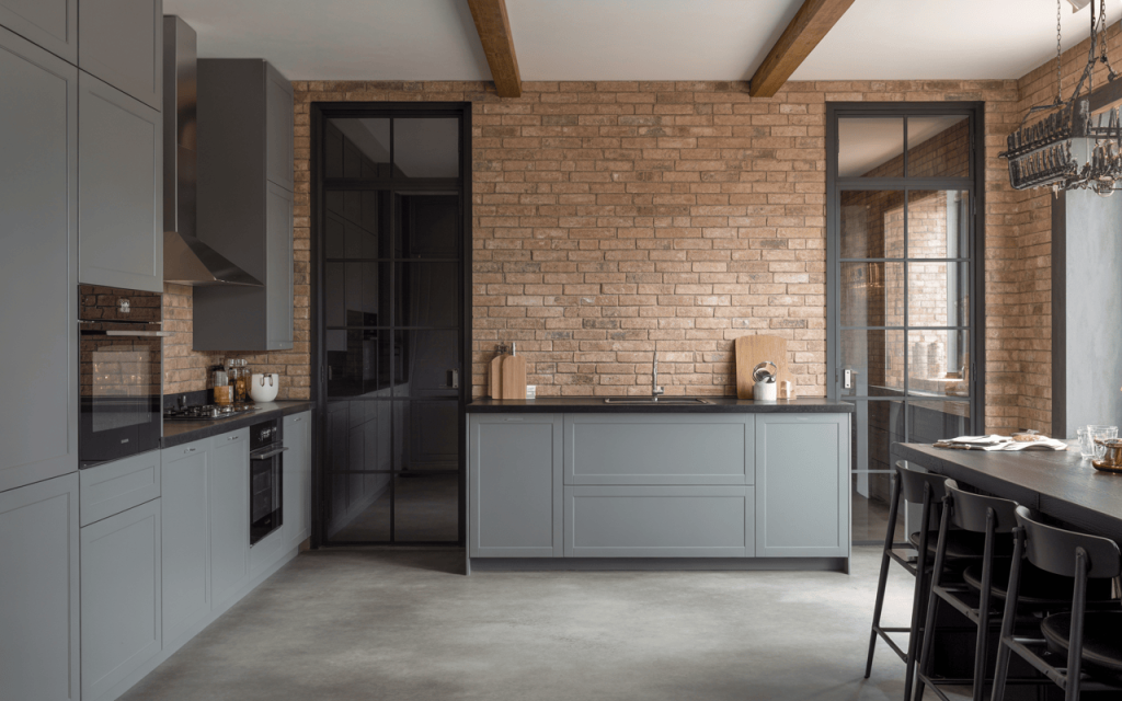 Stylish kitchen glass door design with black metal frames and exposed brick walls