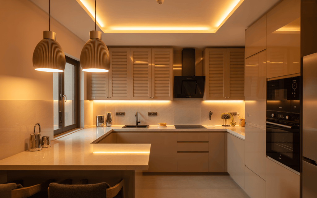 Warm-toned simple small modular kitchen with modern lighting and sleek cabinetry