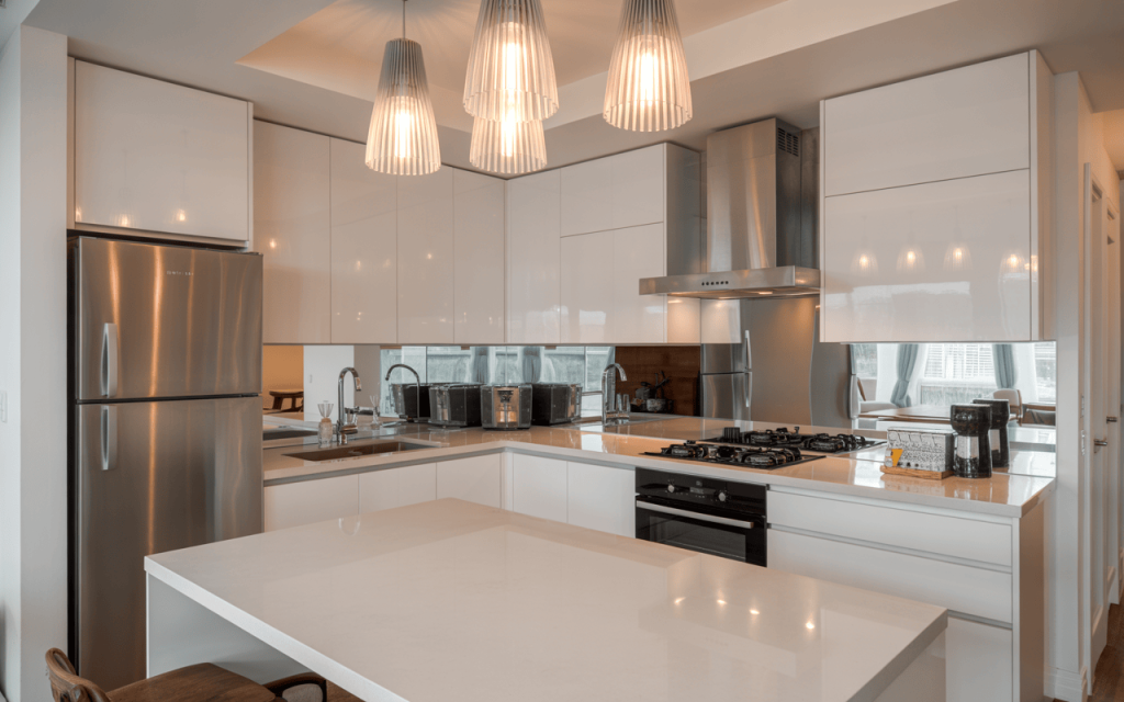 Modern Tiny Kitchen Design with Glossy Cabinets and Pendant Lighting