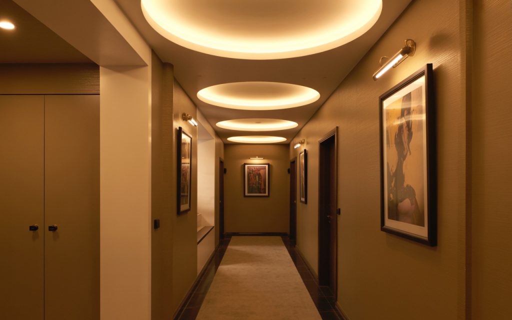 Elegant simple pop design ideas with circular recessed ceiling in warm tone hallway