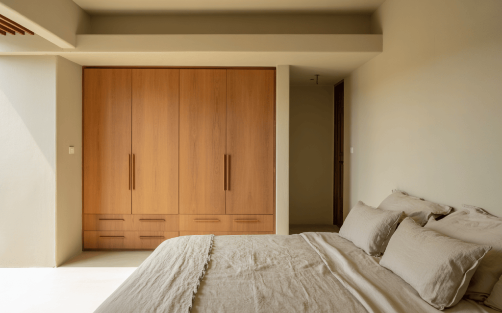 Minimal small wooden almirah design with sleek drawers and clean finishes