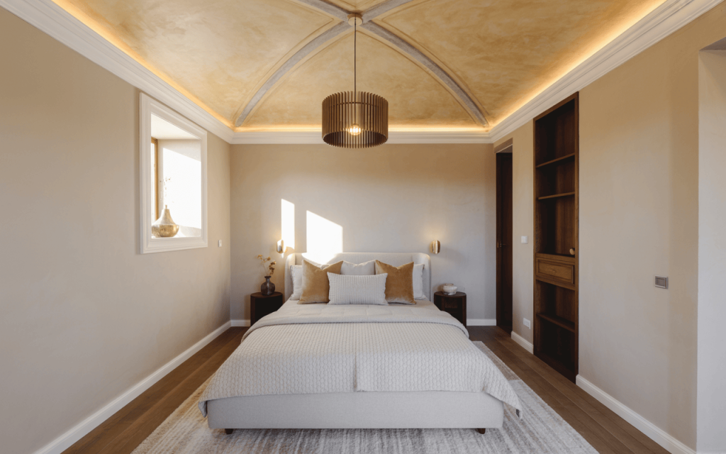 Elegant classic bedroom ceiling design with vaulted curves and warm lighting