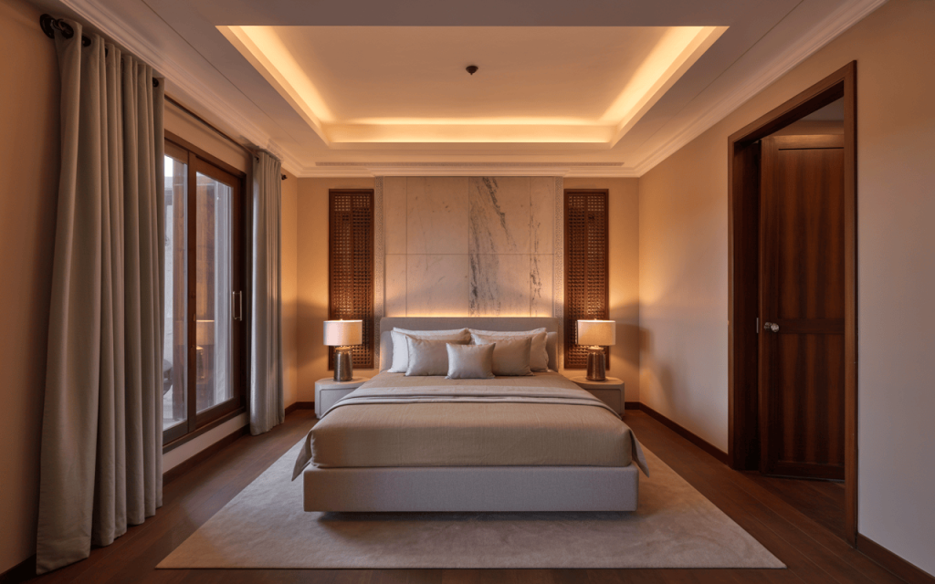 Warm master bedroom ceiling design with recessed lighting and cozy ambiance