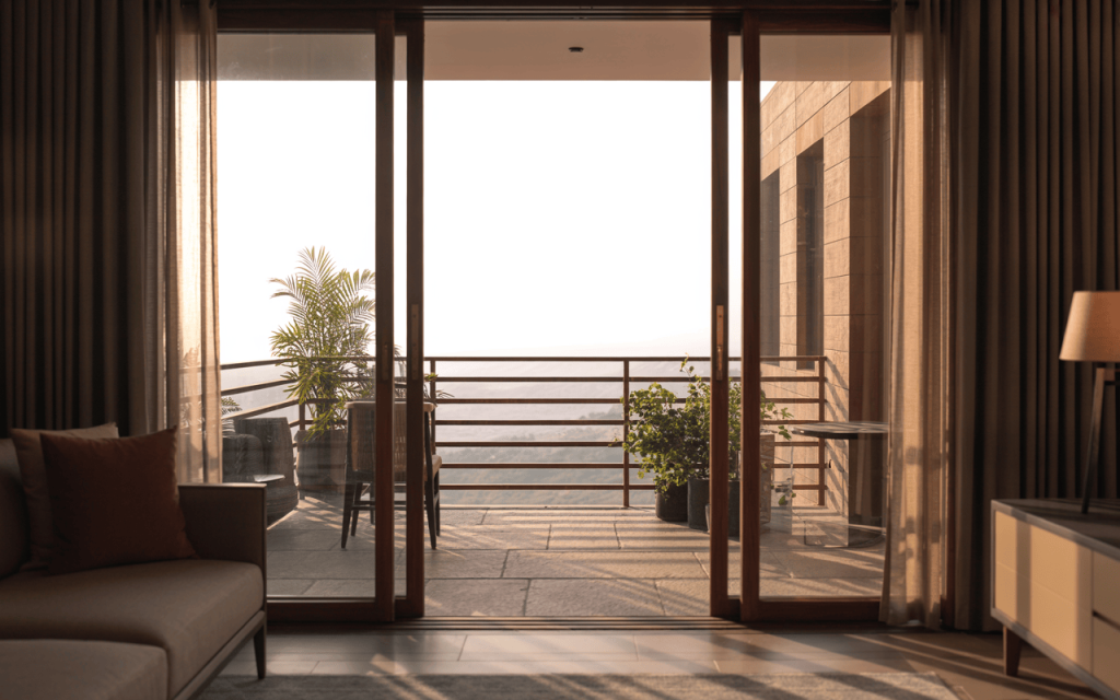 Stylish wood balcony railing design with a serene view and elegant glass doors