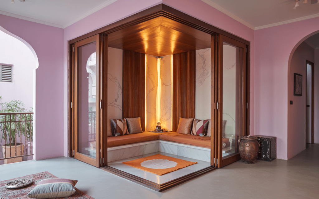 Serene modern home temple design with cozy seating and ambient lighting